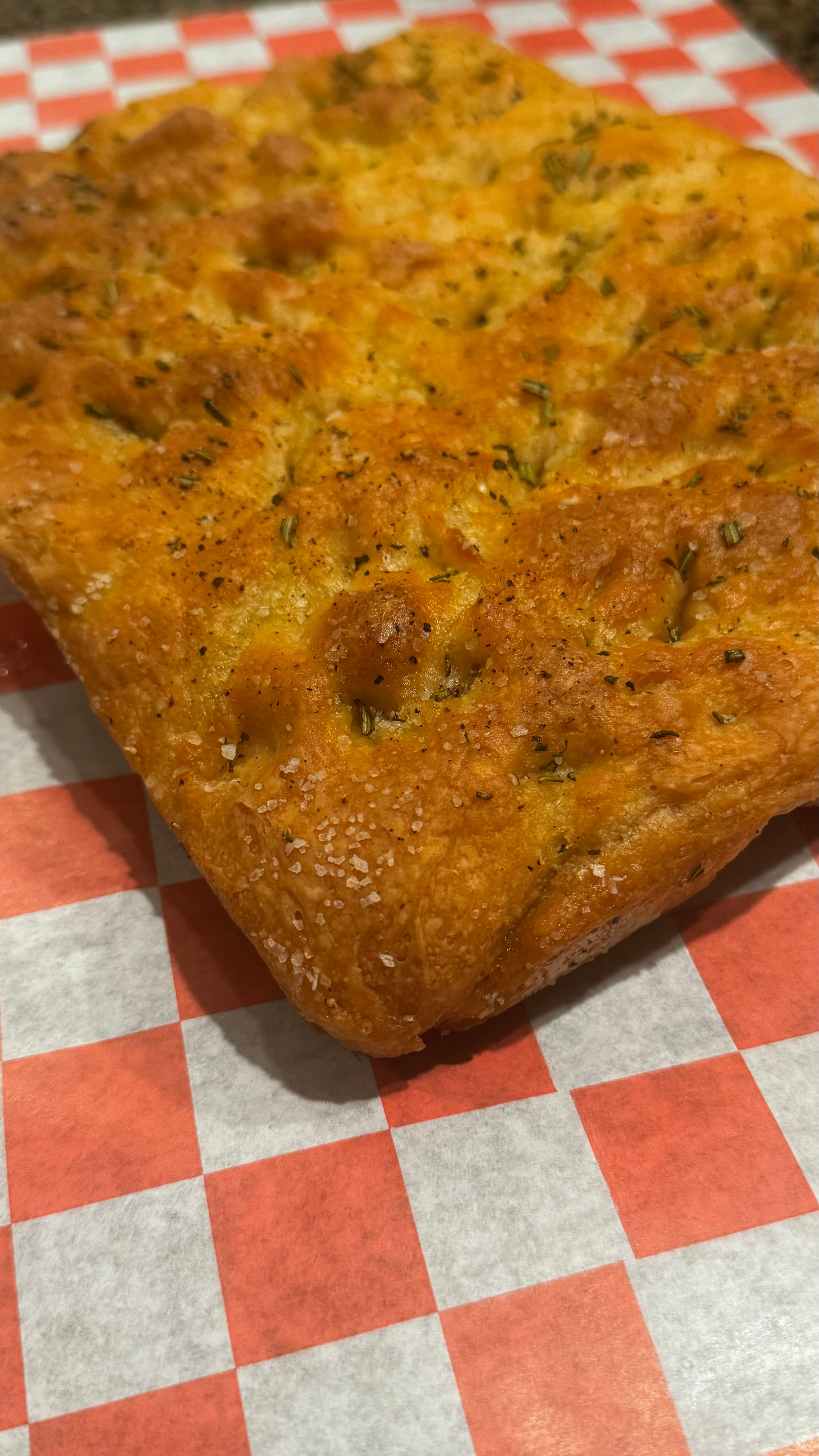 Herb-topped focaccia bread with sea salt