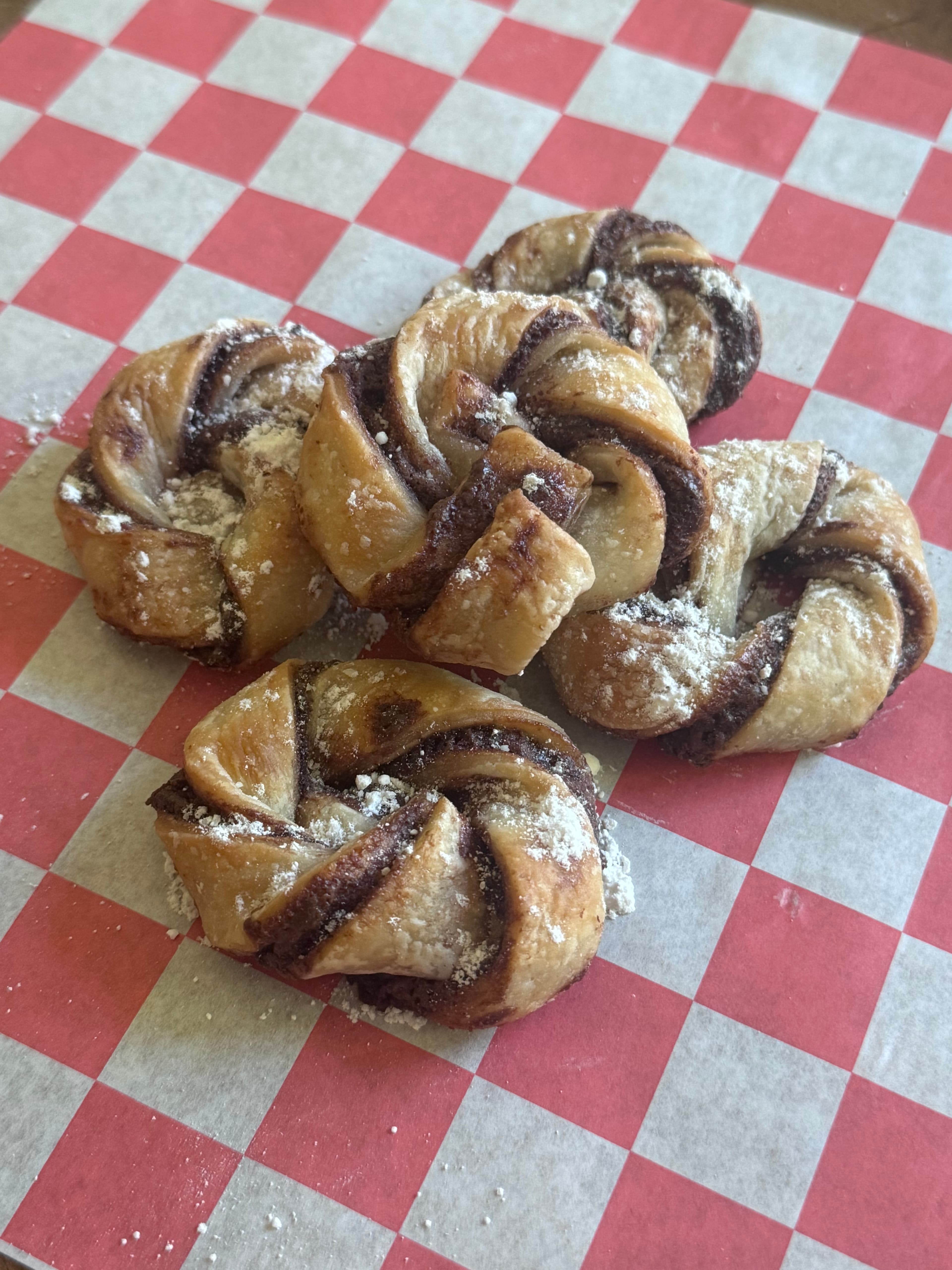Chocolate hazelnut twists dusted with powdered sugar